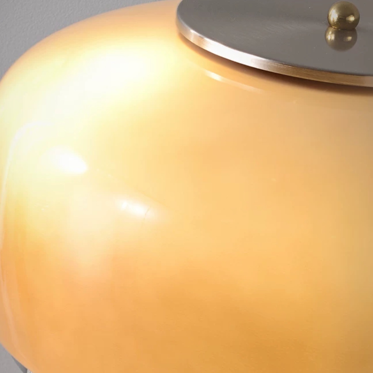 Illuminated smoky taupe glass shade detail