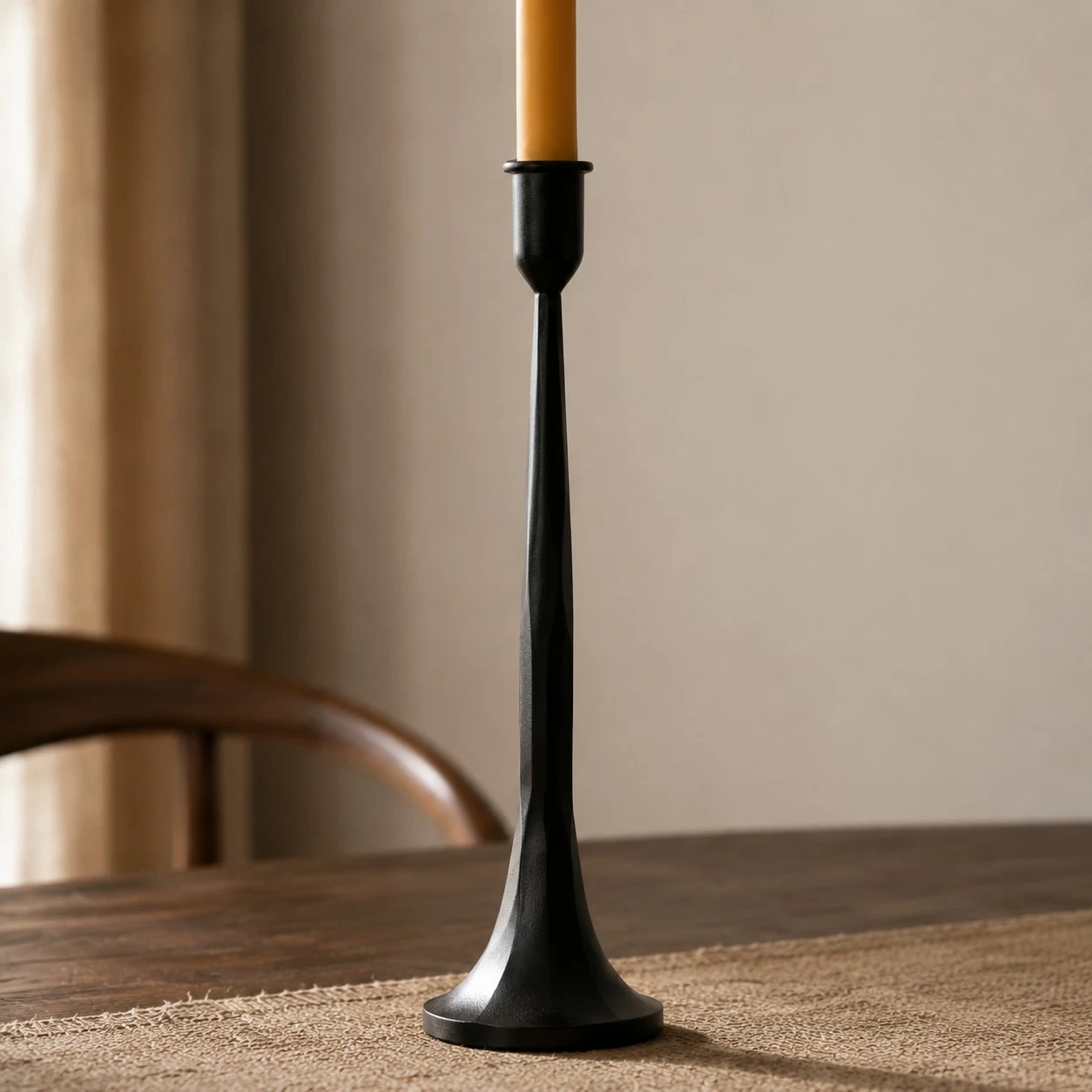 Single tall black iron candle holder profile with flared base