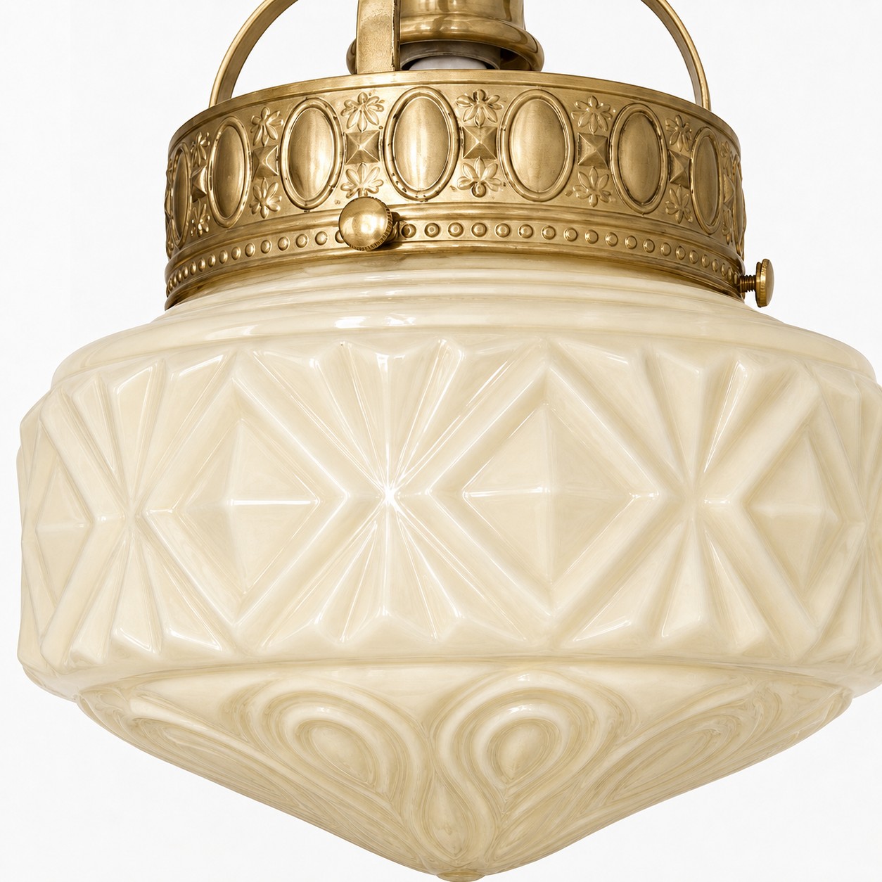 Embossed milk glass shade and brass pendant band detail