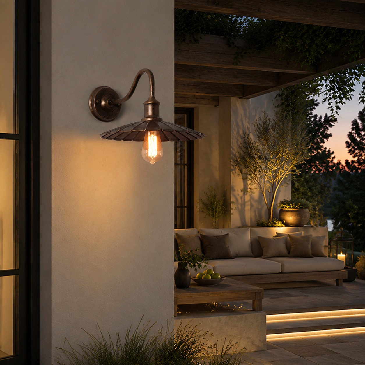 Outdoor wall sconce at a covered exterior entry