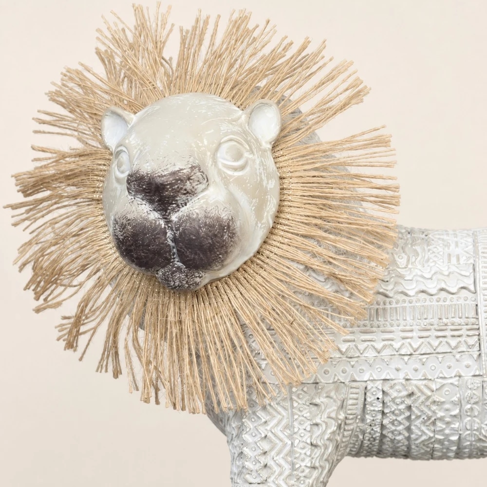 Close detail of the woven lion mane and glossy face