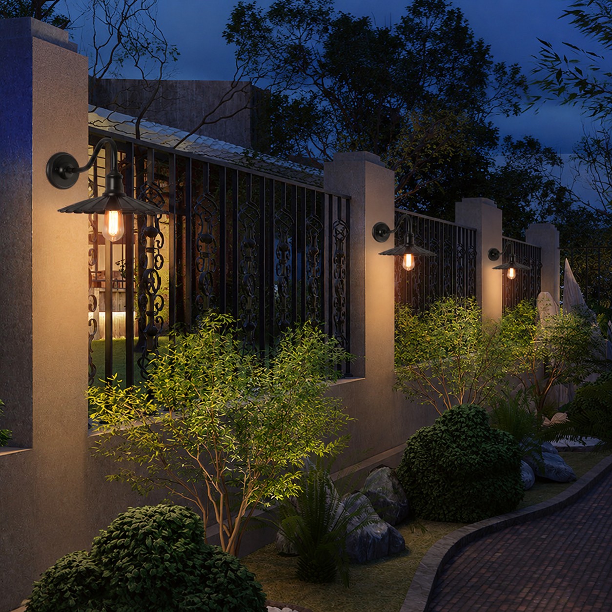 Outdoor wall sconce along a garden path