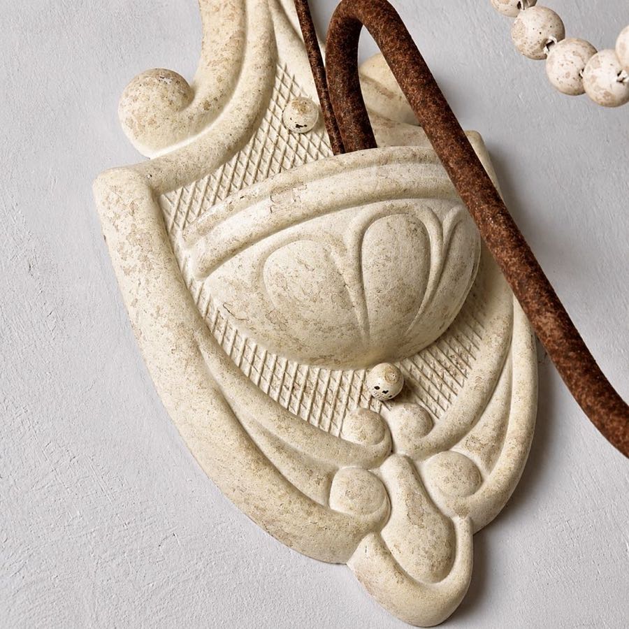 Close view of the carved wood wall plate