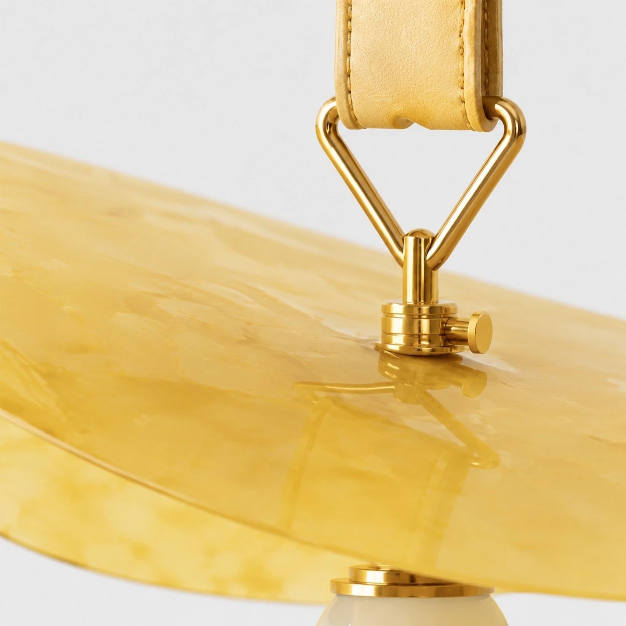 Polished brass connector and shade surface detail