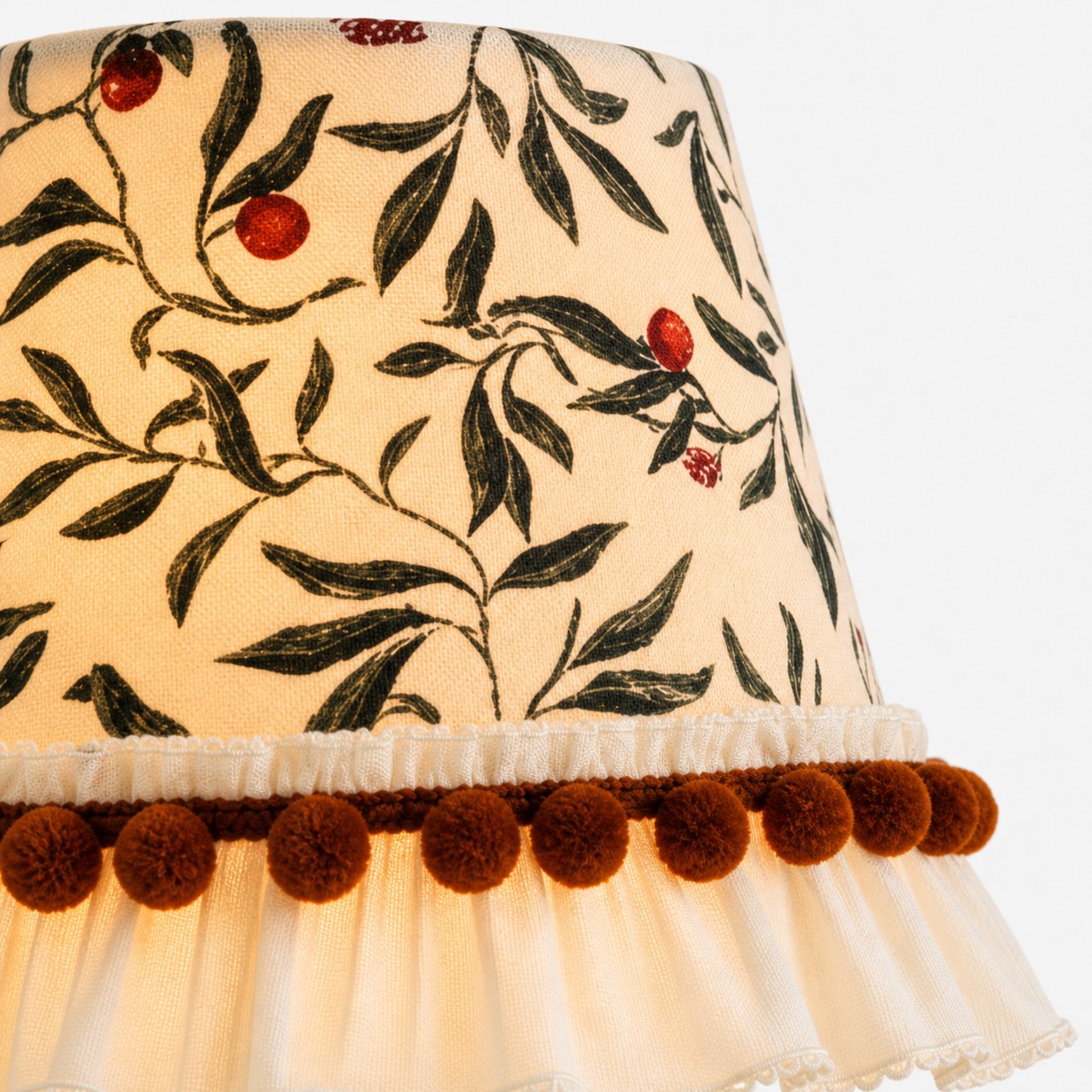 Botanical fabric shade with pom-pom trim