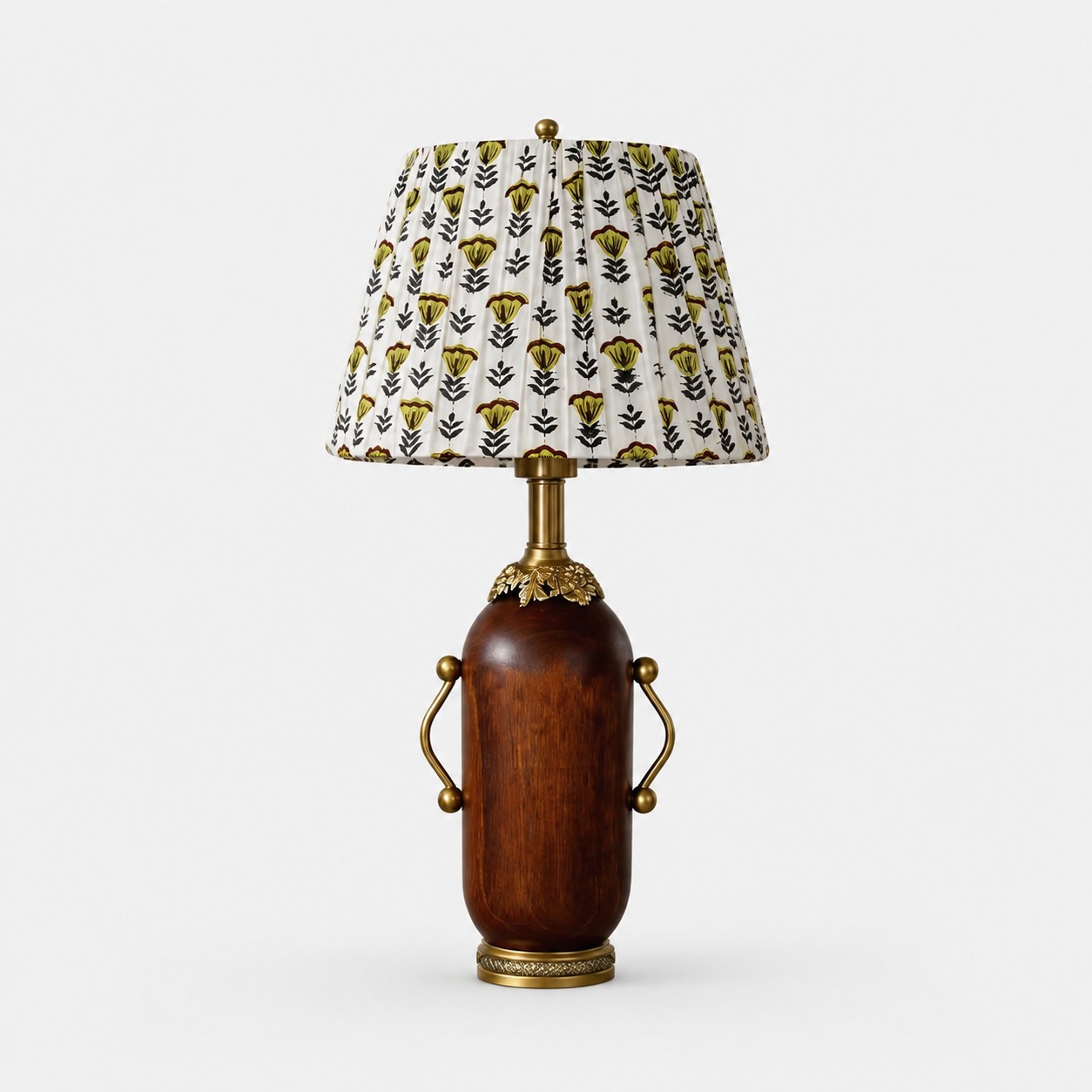 Deep brown vintage table lamp with yellow floral pleated shade on white background