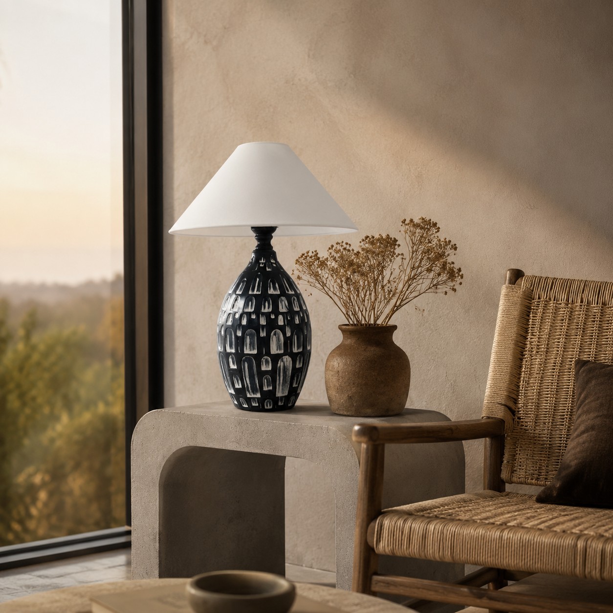 Black ceramic table lamp styled in a warm lounge corner